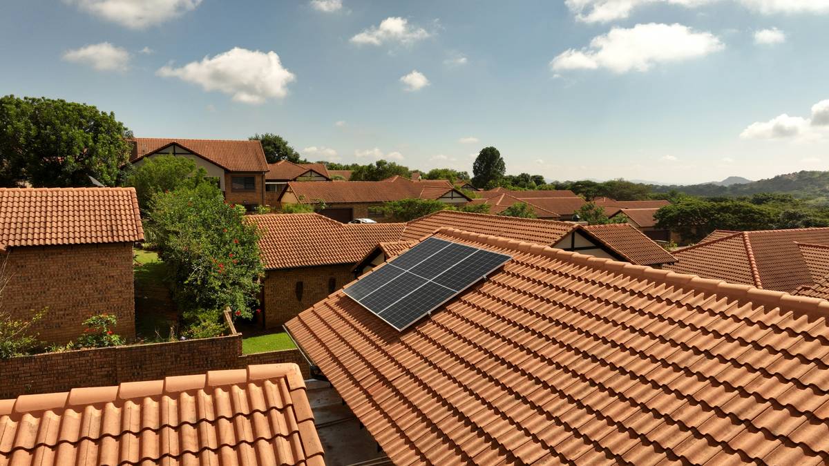 solar technology monocrystalline panel why are installed on a suburban rooftop with partial shading from a tree